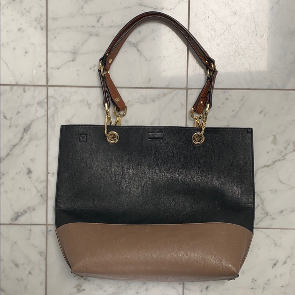 Black and taupe leather cross body bag.
